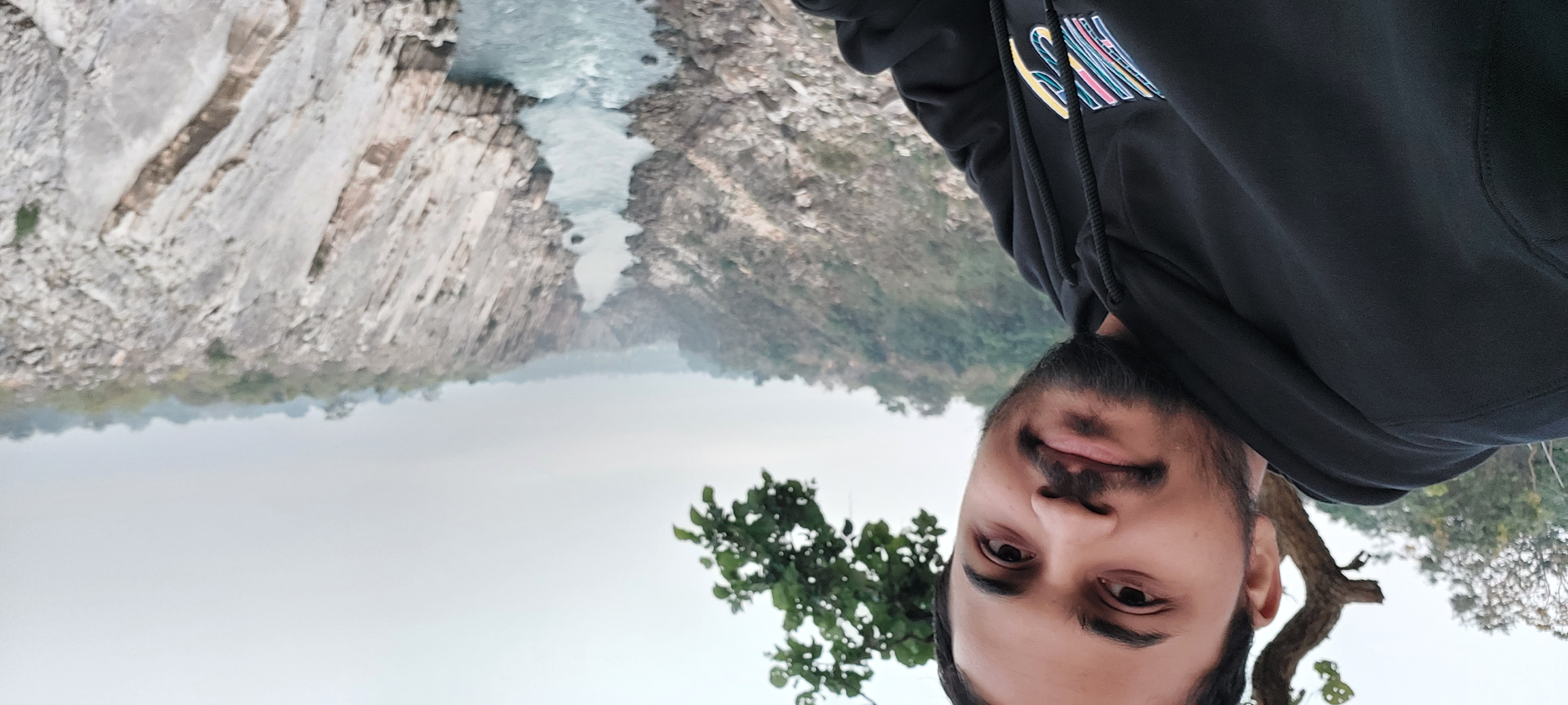 Niraj Bajaj posing for a selfie with the towering 100-foot white marble rocks of Bhedaghat located near Jabalpur in Madhya Pradesh in the background.